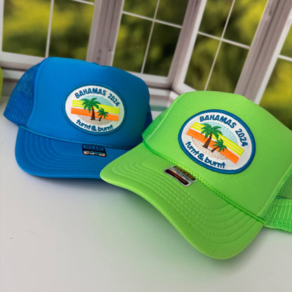 Turquoise blue and neon green trucker hats with oval palm tree Bahamas 2024 patch